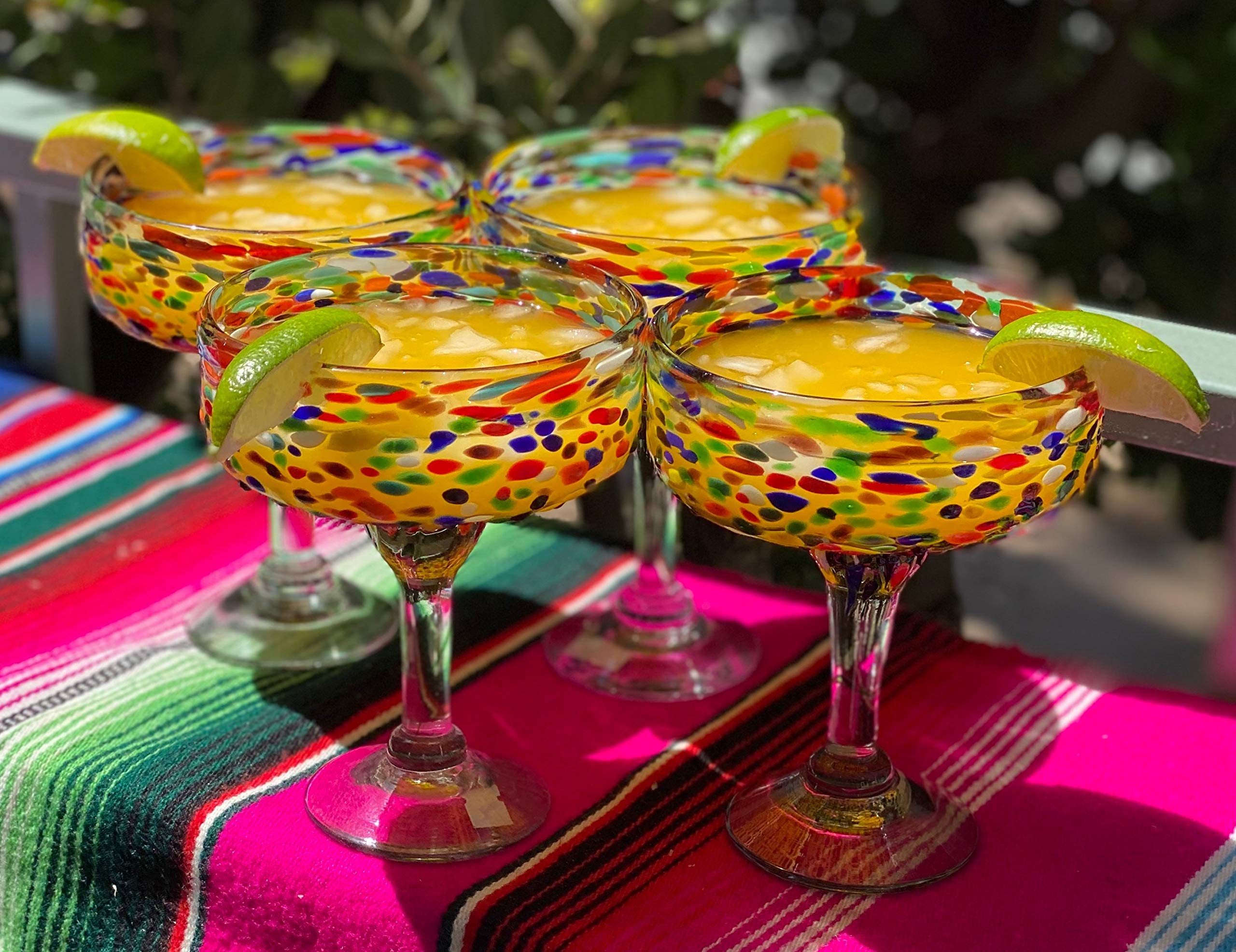 Dos Sueños glass mid-pour with margarita showing generous capacity and garnish space