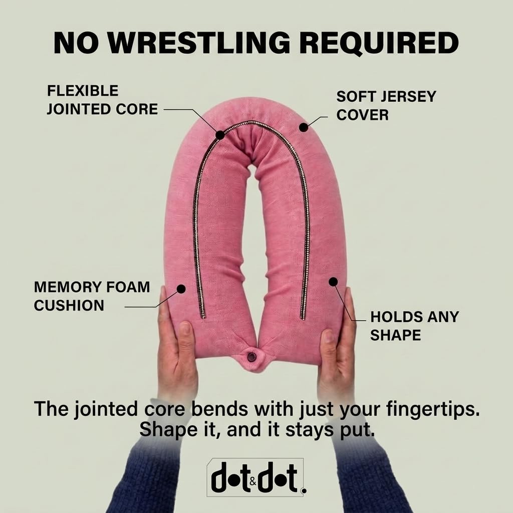 Dot&Dot pillow snapped to carry-on luggage demonstrating hands-free travel convenience
