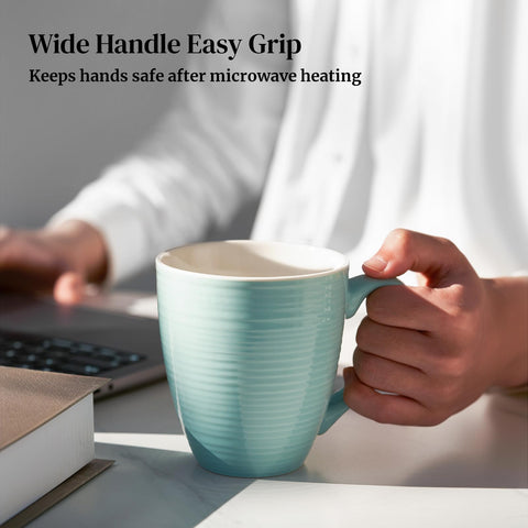 DOWAN mug in hand demonstrating 17 oz capacity and real scale