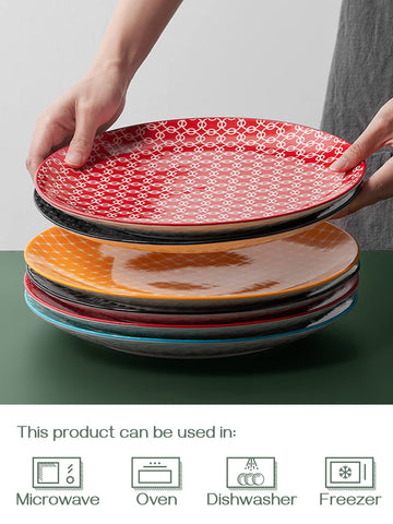 DOWAN plate beside fork and knife showing true 10-inch scale and portioning benefit