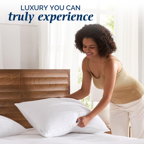 downluxe pillow styled on a made bed illustrating cozy bedroom benefit
