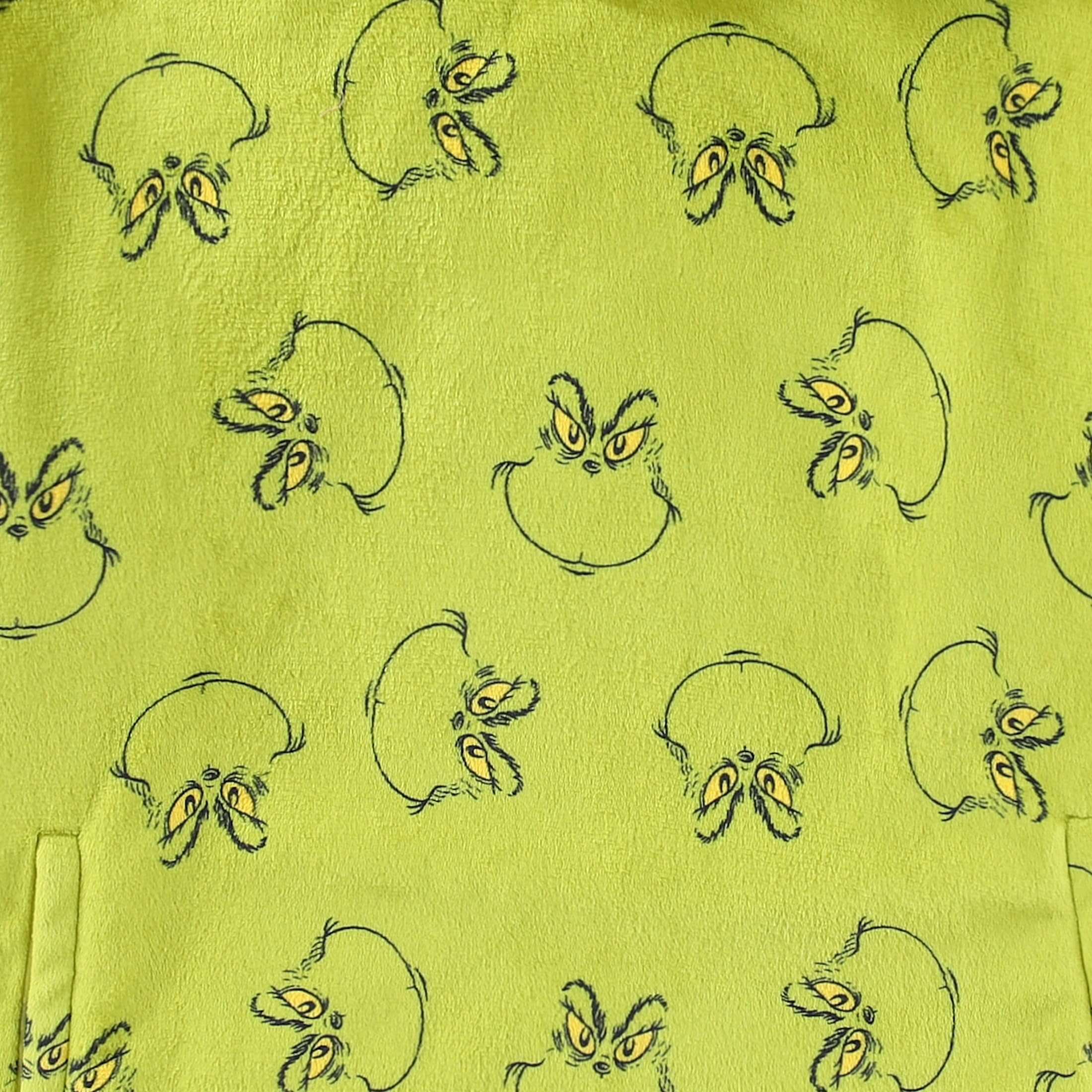 Dr. Seuss Grinch allover print pattern showcasing bold character graphics