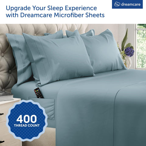 DREAMCARE fitted sheet close-up showing extra-deep pocket and secure fit benefit