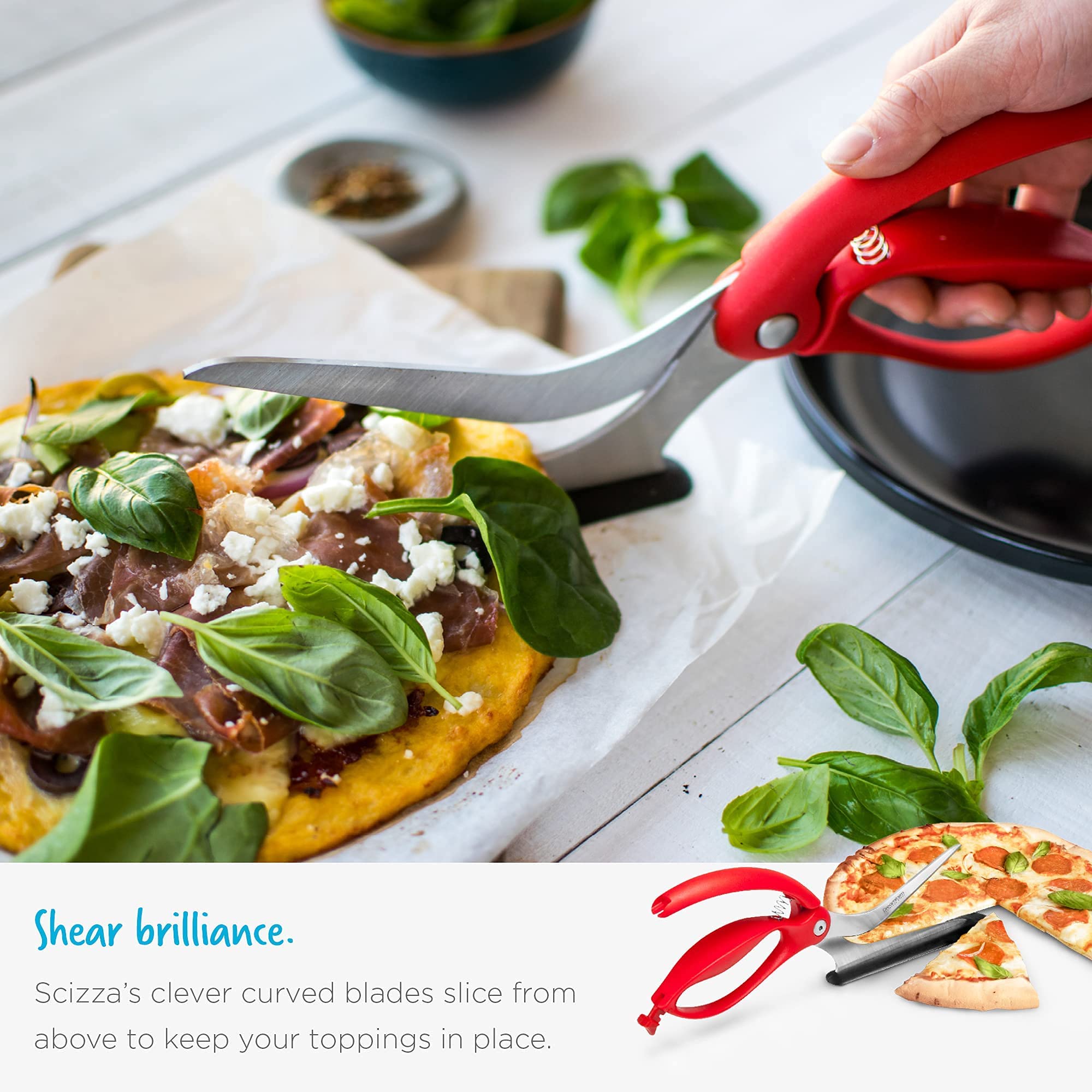 Dreamfarm Scizza lifting a pizza slice onto a plate showing neat serving without mess