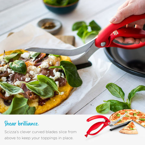 Dreamfarm Scizza lifting a pizza slice onto a plate showing neat serving without mess