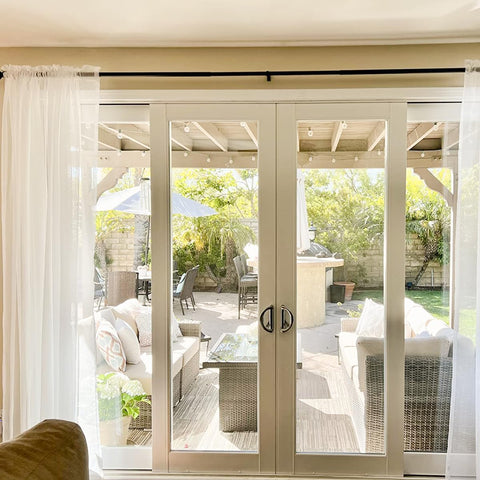 Dreaming Casa layered with heavier curtains showing versatile styling options