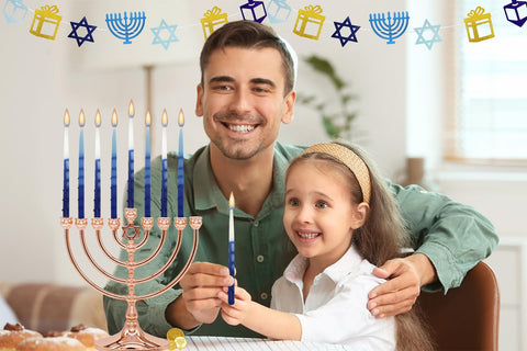 The Dreidel Company hand placing a candle into a menorah demonstrating secure fit and ease