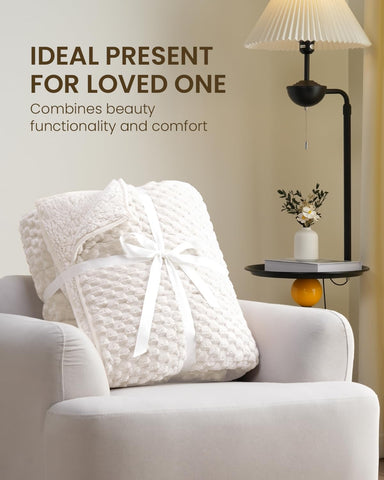 Drewin blanket in bedside reading scene offering relaxing comfort