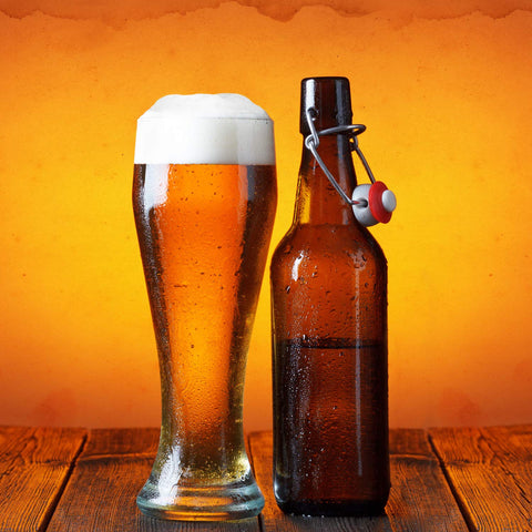DU VINO pouring golden pilsner into glass highlighting carbonation and head retention