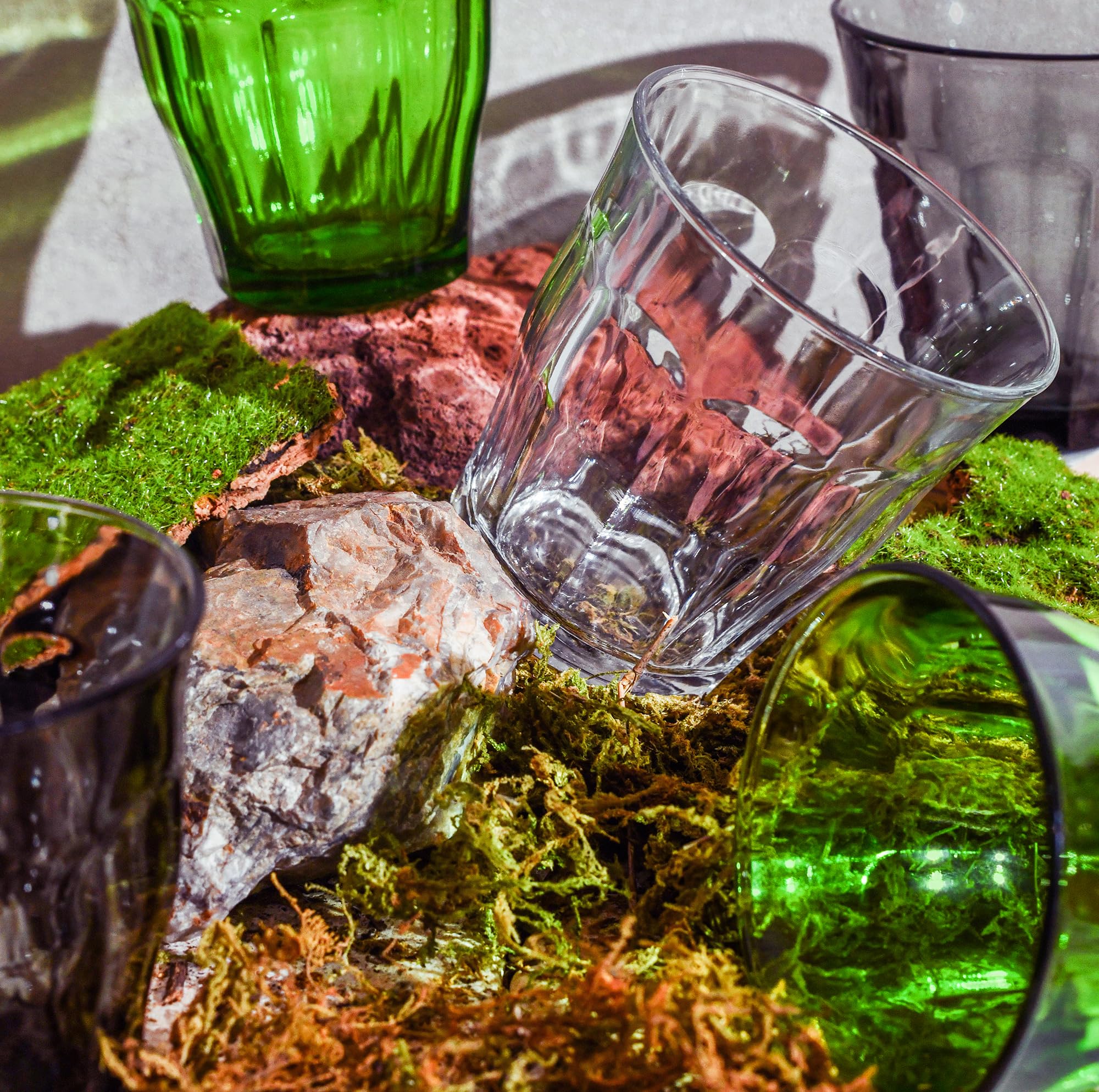 Duralex glass held next to hand to show compact 20 cl size