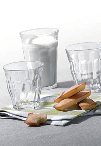 Duralex Picardie stacked tumblers beside a hand for scale showing space-saving benefit
