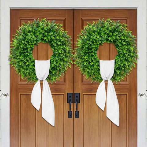 Dushle wreath styled on mantel adding timeless greenery