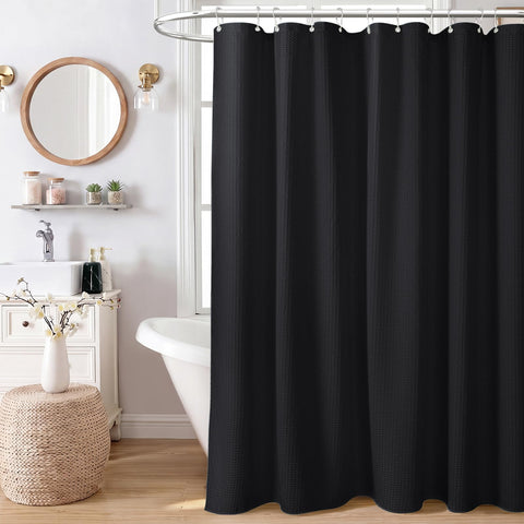 Dynamene in styled bathroom creating spa-like atmosphere and modern contrast