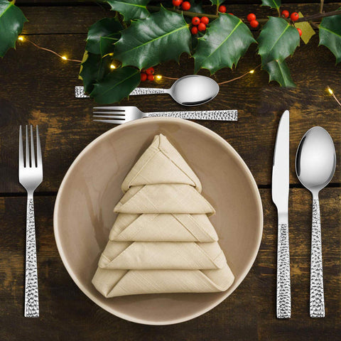 E-far spoon head close-up reflecting light to show easy-clean polished finish benefit