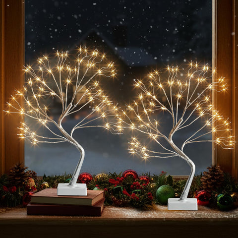EAMBRITE front view of 17-inch silver fairy light tree showing warm glow and silhouette
