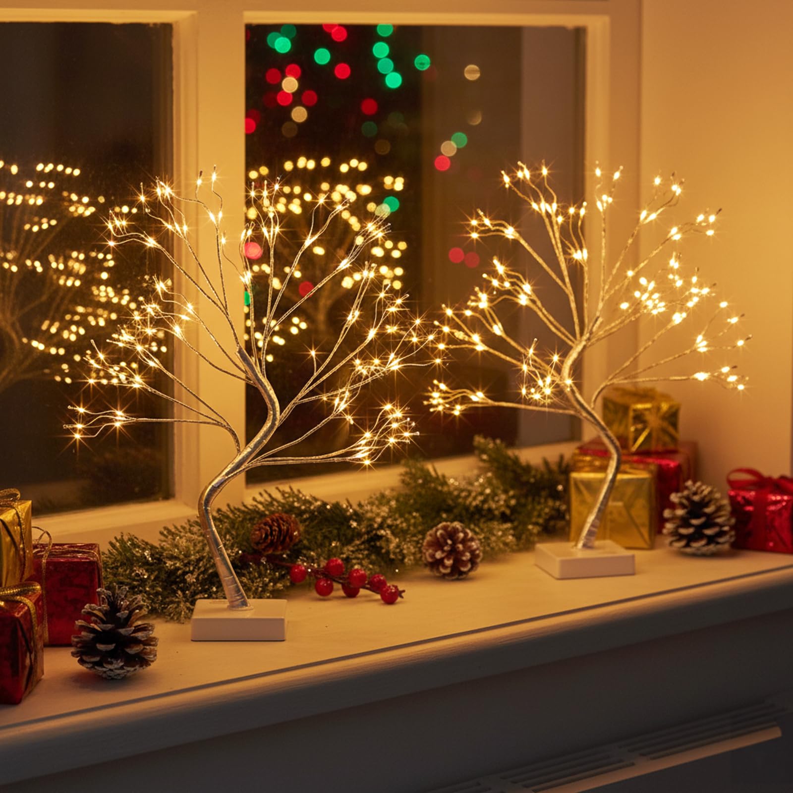 EAMBRITE tree beside a book to show 17-inch scale and tabletop suitability