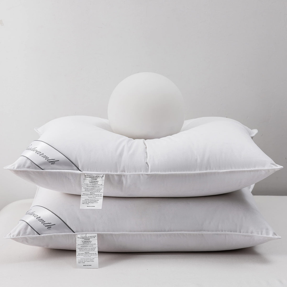 Eastwarmth front view of two packaged pillows showing clean hotel-style presentation and protection
