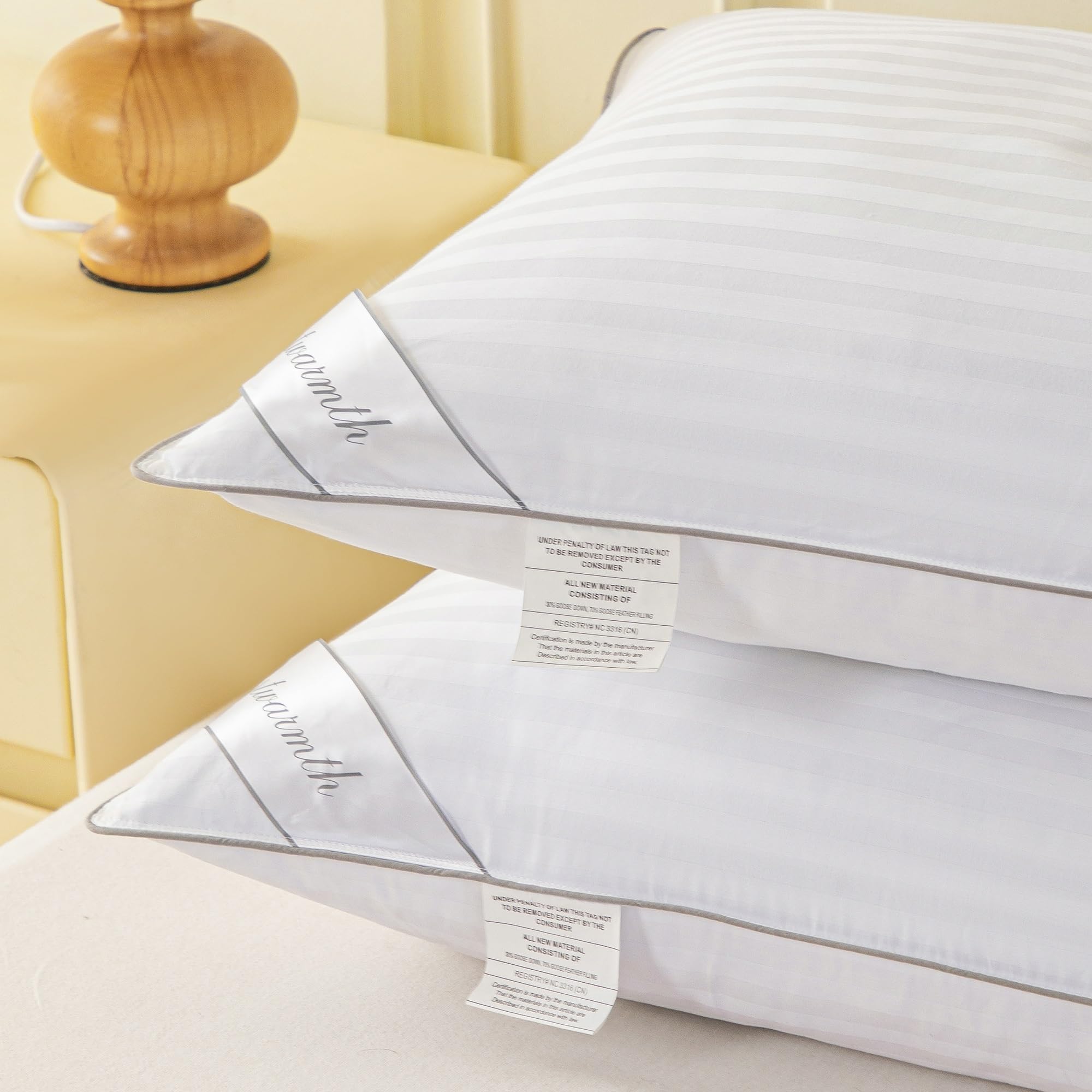 Eastwarmth pillow styled on bed illustrating hotel-look comfort and bedroom appeal