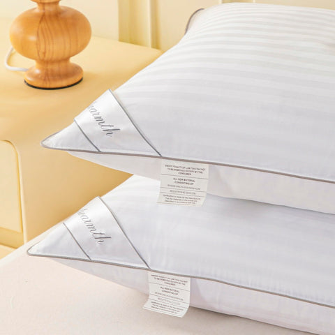 Eastwarmth pillow styled on bed illustrating hotel-look comfort and bedroom appeal
