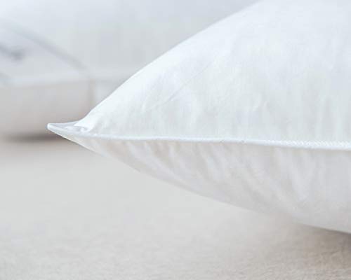 Eastwarmth pillows styled on a made bed conveying hotel comfort and comfortable sleep surface