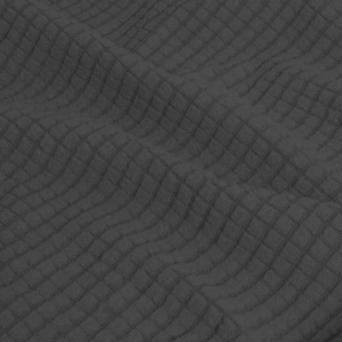 Easy-Going cover on sofa with measuring tape showing large size fit