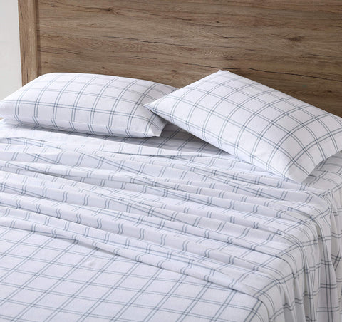 Eddie Bauer styled bed with Westridge Plaid blue sheets illustrating cozy bedroom vibe