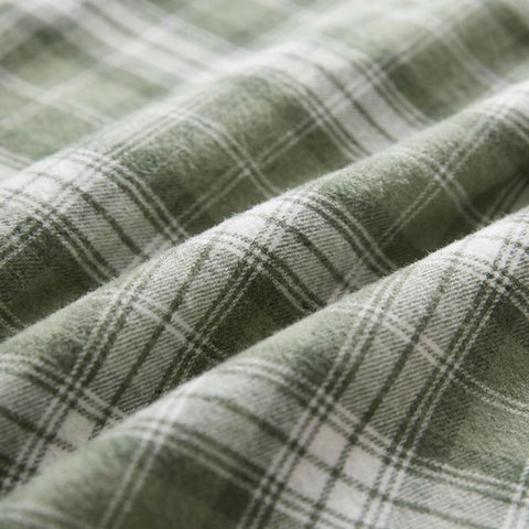Eddie Bauer styled bedroom with sheets on bed showing cozy winter atmosphere