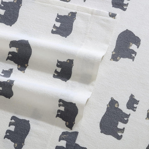 Eddie Bauer sheet set on a made bed in a cabin-style room offering cozy aesthetic benefit