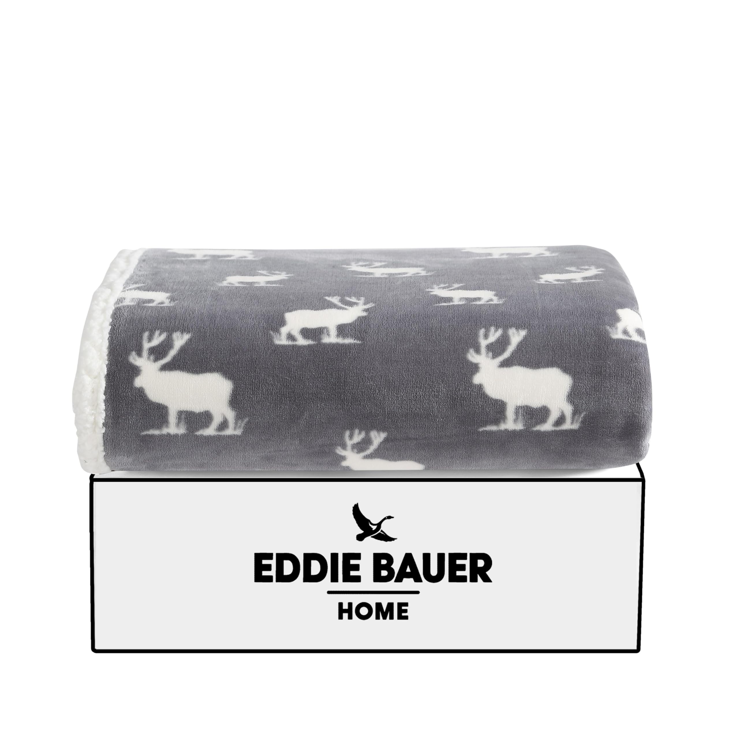 Eddie Bauer throw draped on couch in living room offering warm, rustic style