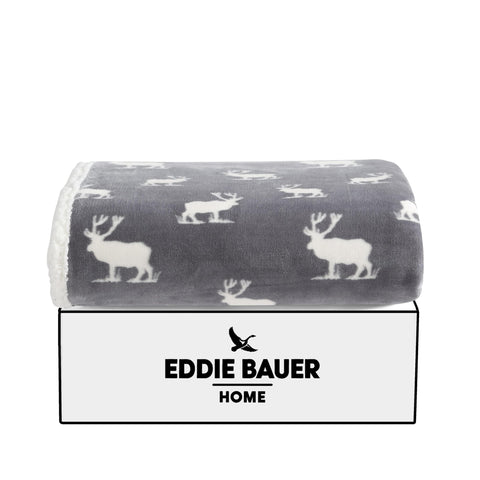 Eddie Bauer throw draped on couch in living room offering warm, rustic style