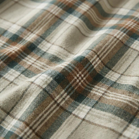 Eddie Bauer flannel sheets made on a styled bed adding cozy atmosphere