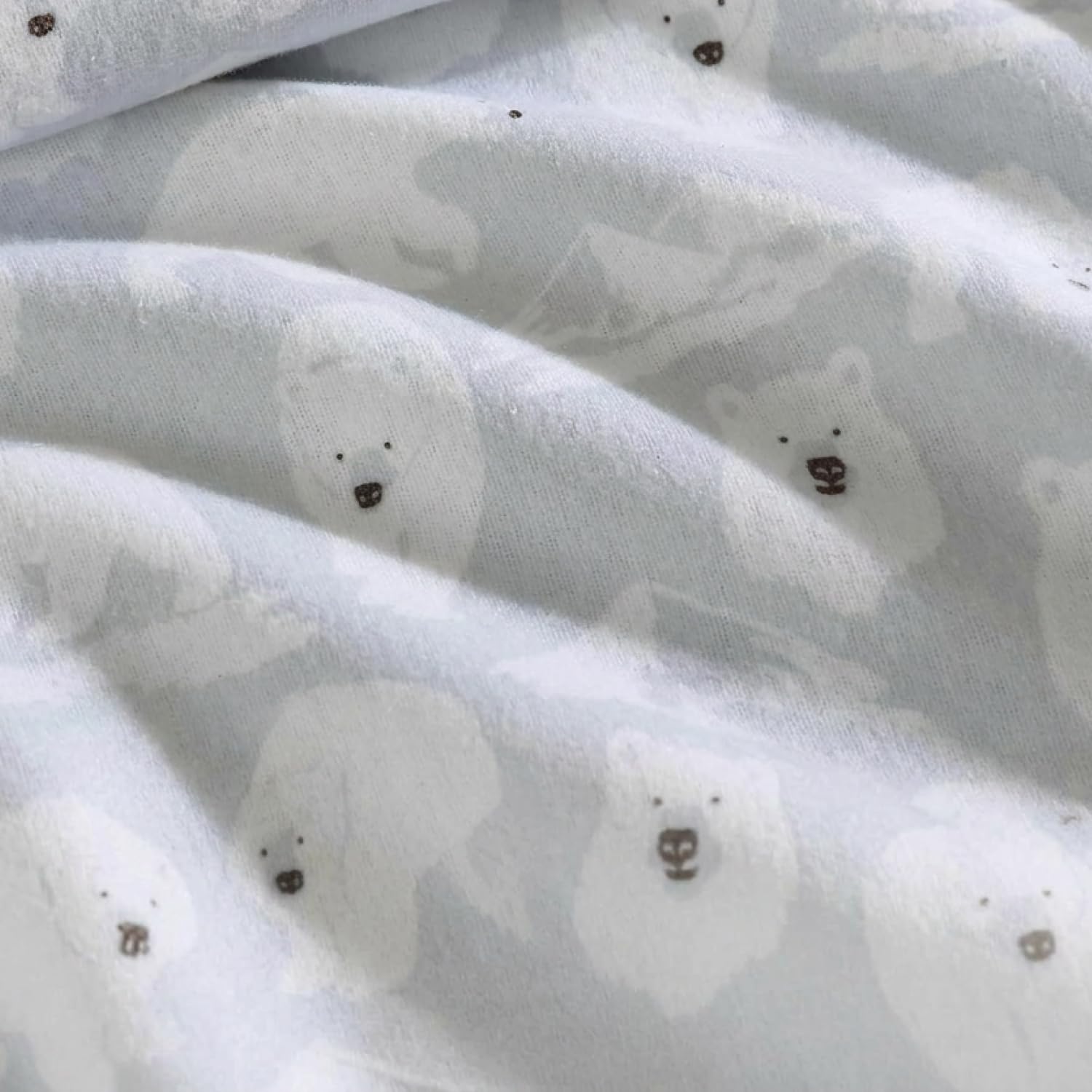 Eddie Bauer sheets styled on a made bed conveying cozy bedroom warmth
