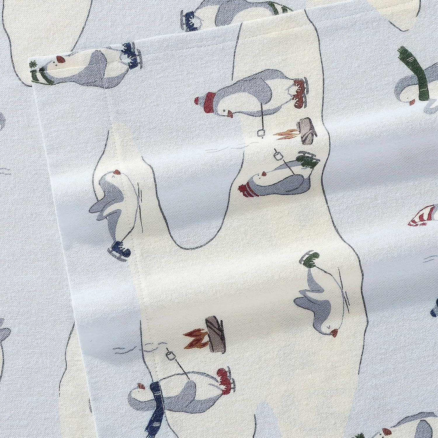 Eddie Bauer skating penguin pattern detail highlighting playful design and style