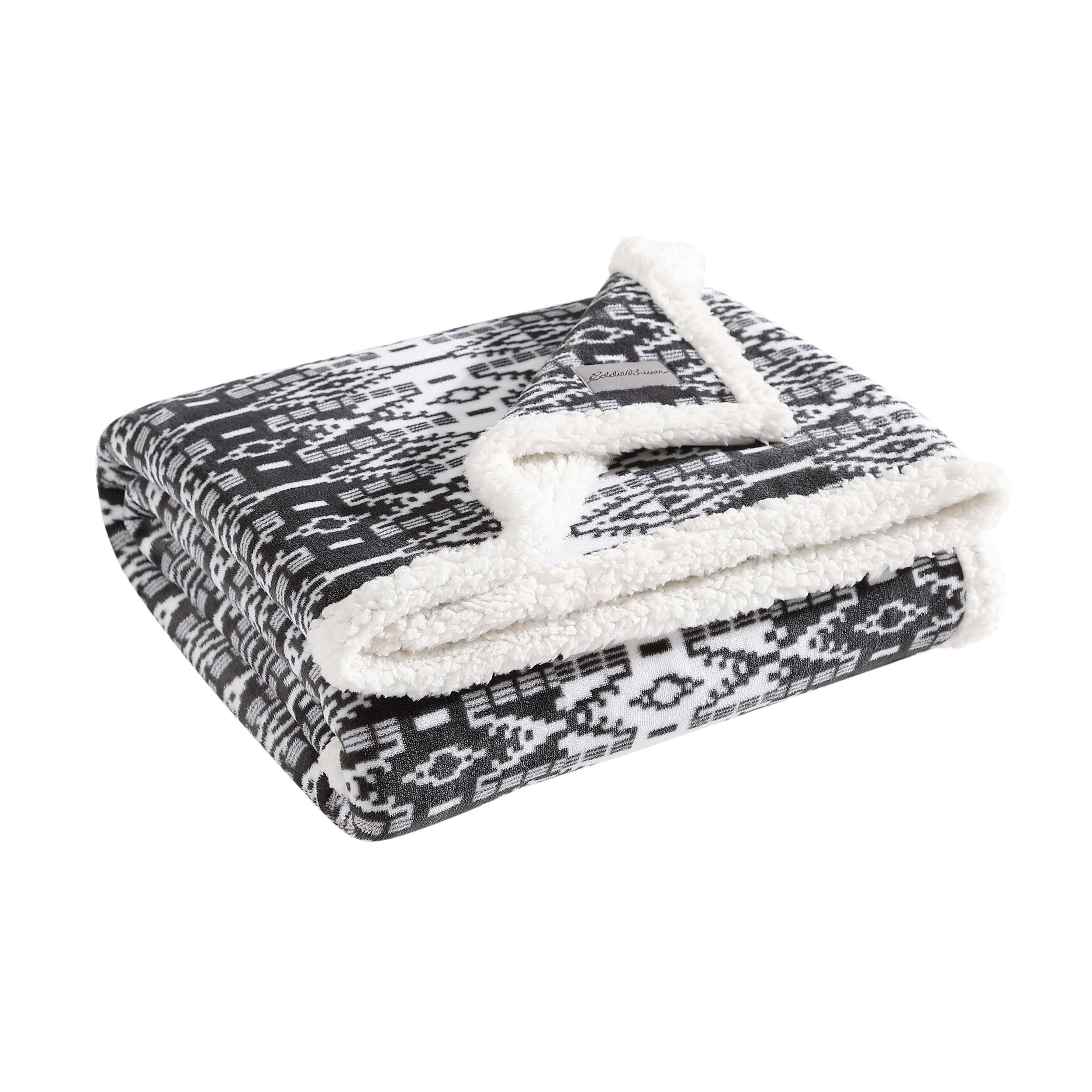 Eddie Bauer throw at foot of bed adding layered bedroom comfort