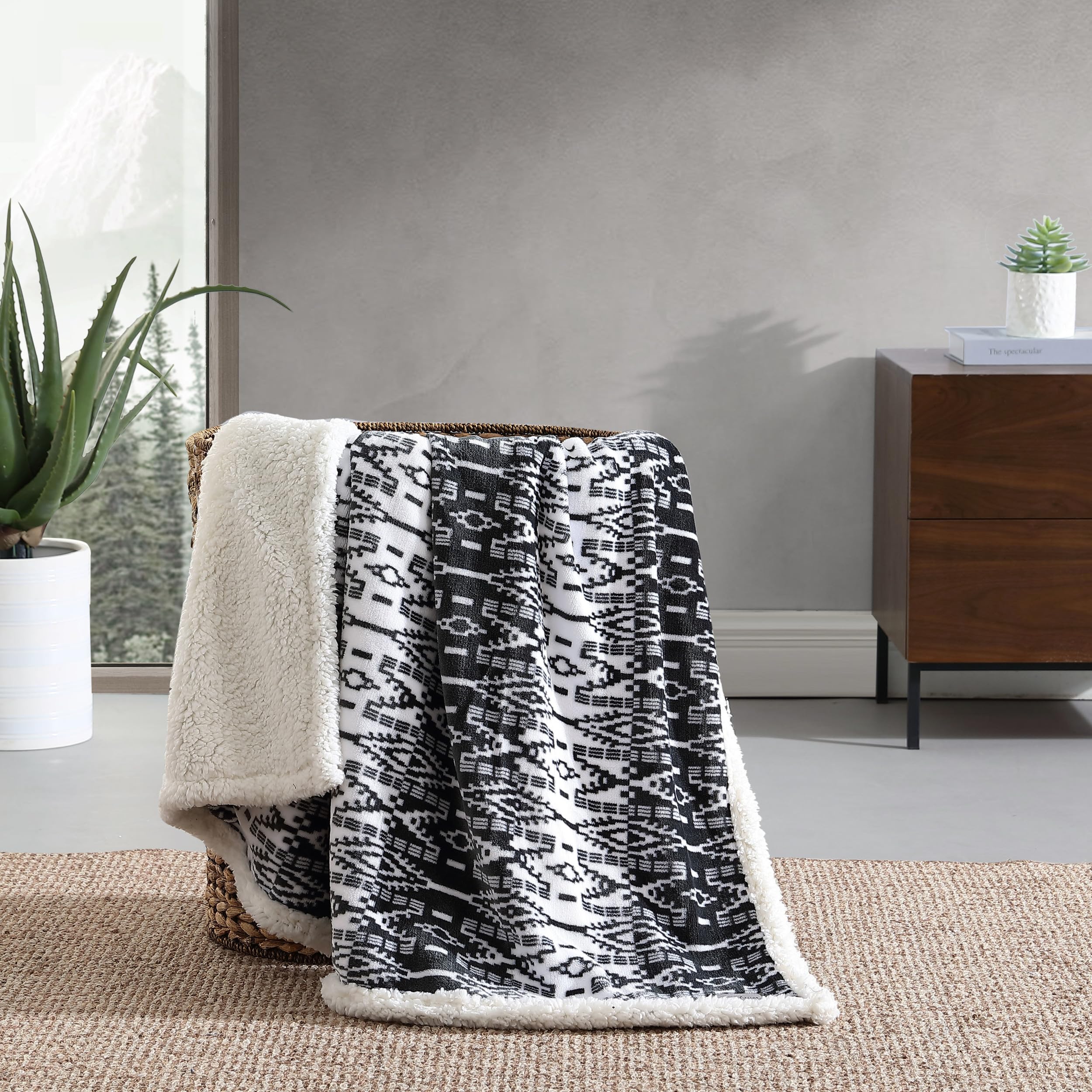 Eddie Bauer throw draped on couch creating comfortable living space