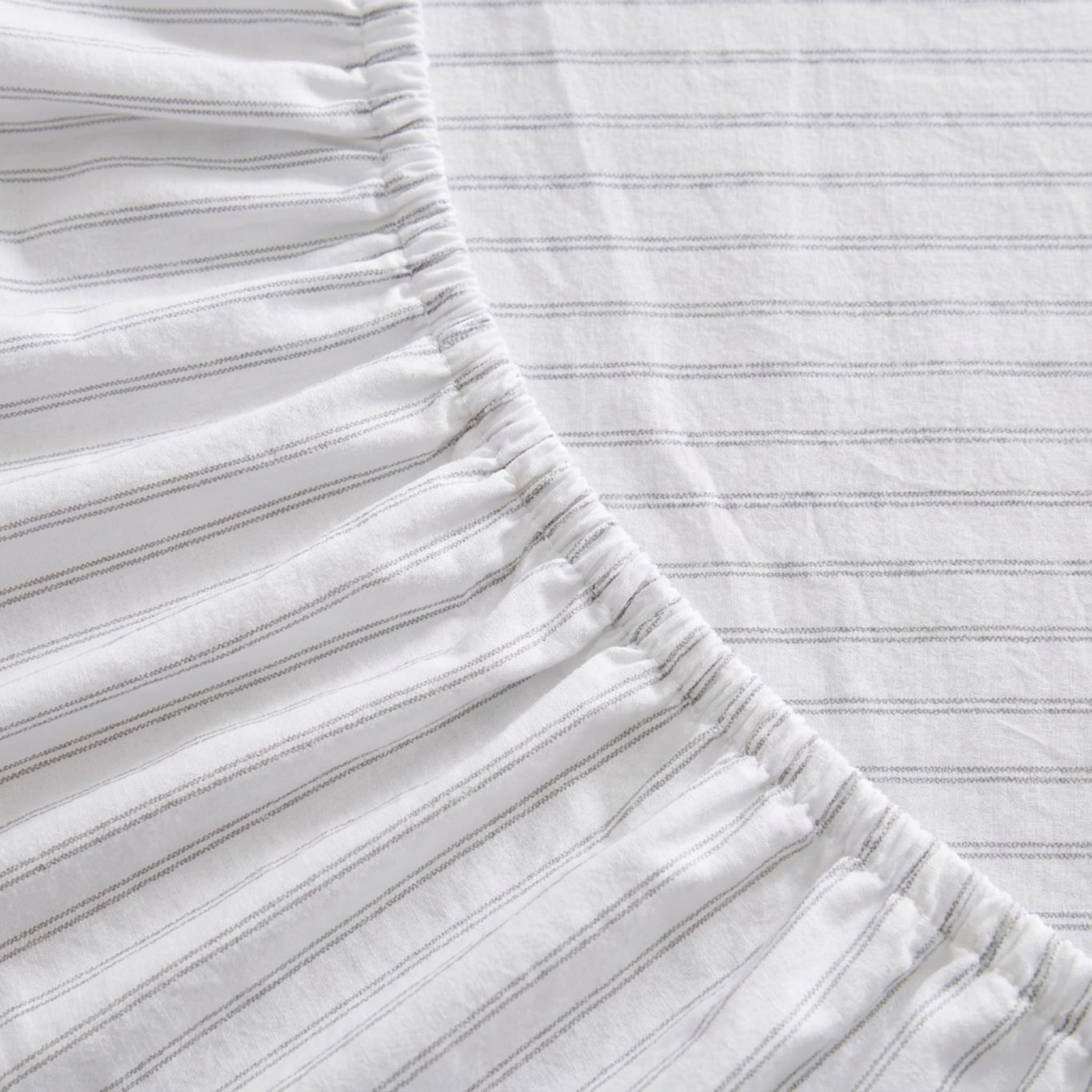 Eddie Bauer styled bedroom with Trail Stripe sheets creating warm outdoors-inspired atmosphere