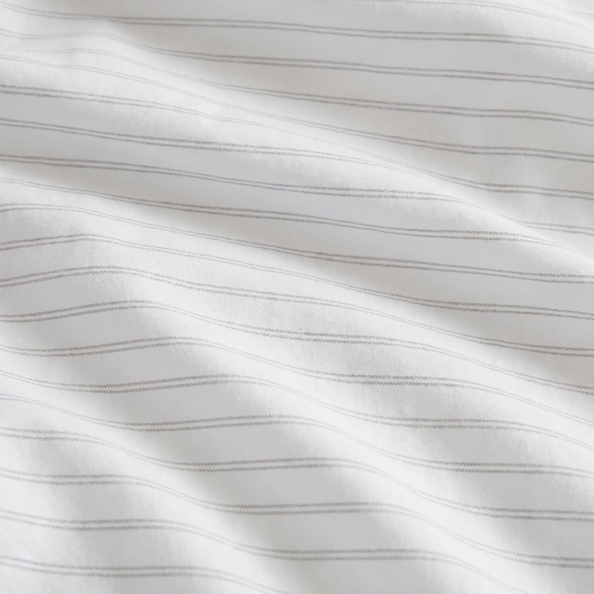 Eddie Bauer sheet set draped on a twin mattress to show scale and proper fitted coverage