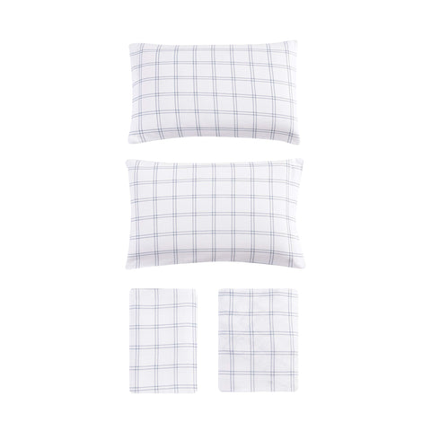 Eddie Bauer made bed with Westridge Plaid set in a warm bedroom setting