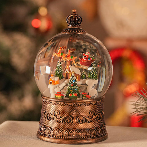 EDDORUNNING front view of elk snow globe showing festive scene and glow benefit