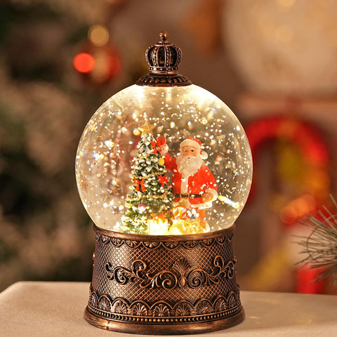 EDDORUNNING snow globe styled on holiday tabletop creating layered seasonal display