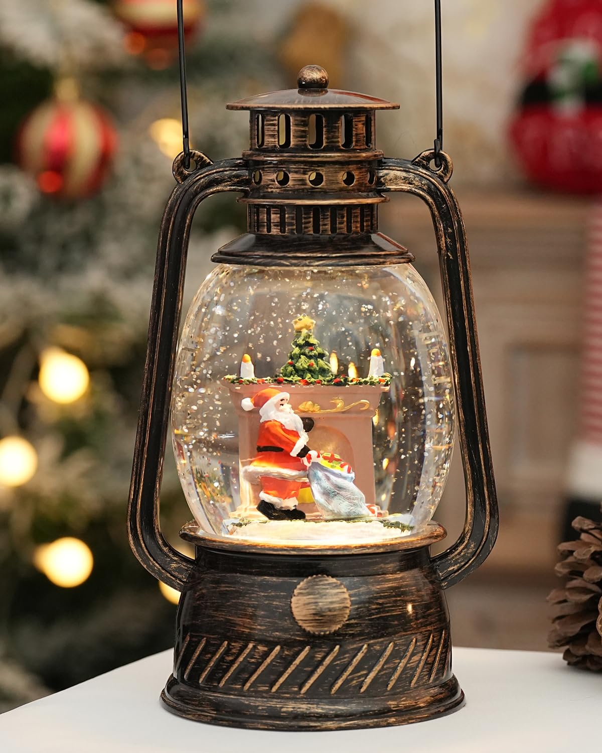 EDDORUNNING front view of lighted snow globe showing warm glow and Santa scene