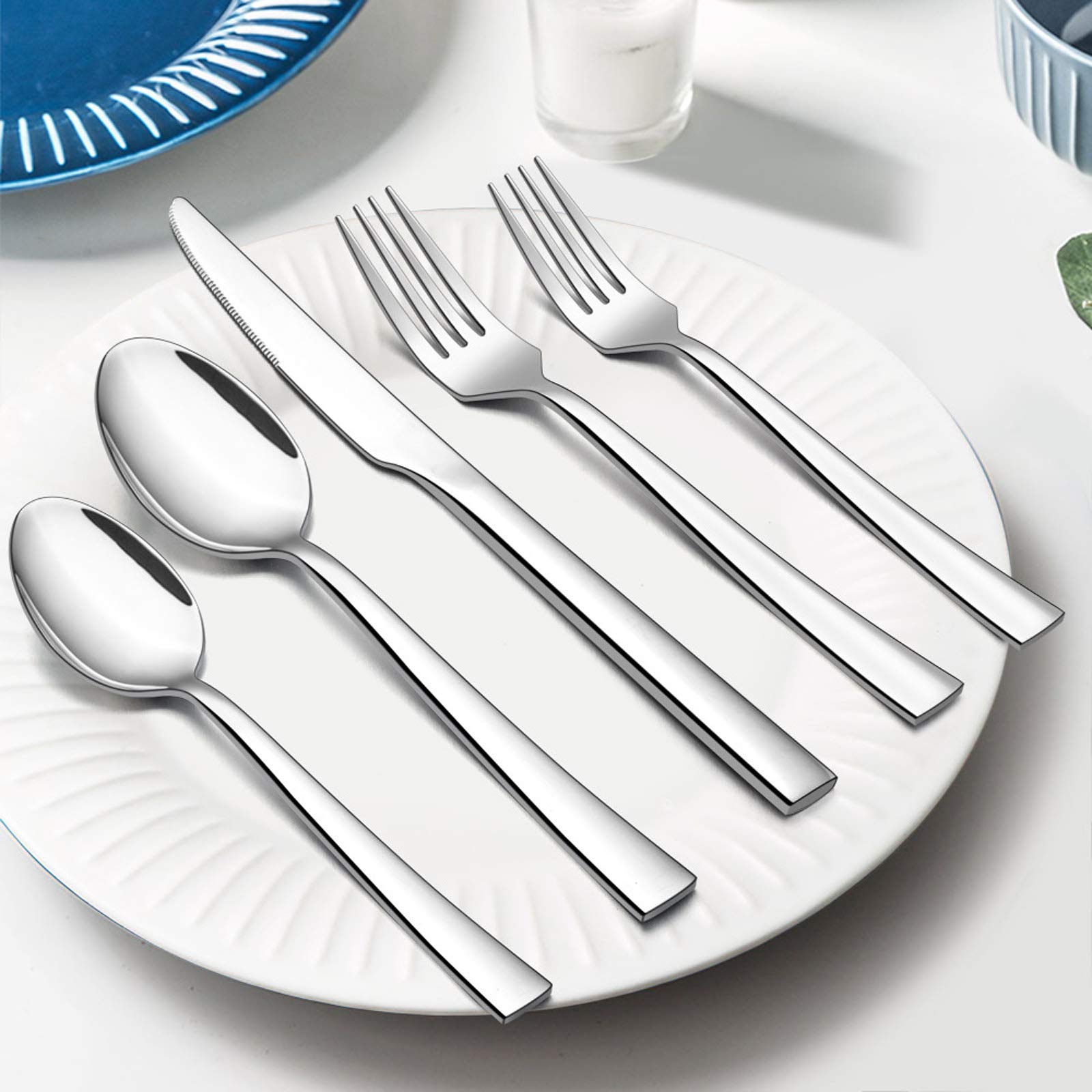 E-far spoons held in hand to show size and comfortable weight
