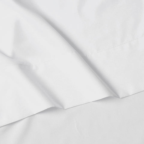 Elegance Linen stretched over thick mattress showing snug all-around elastic hold