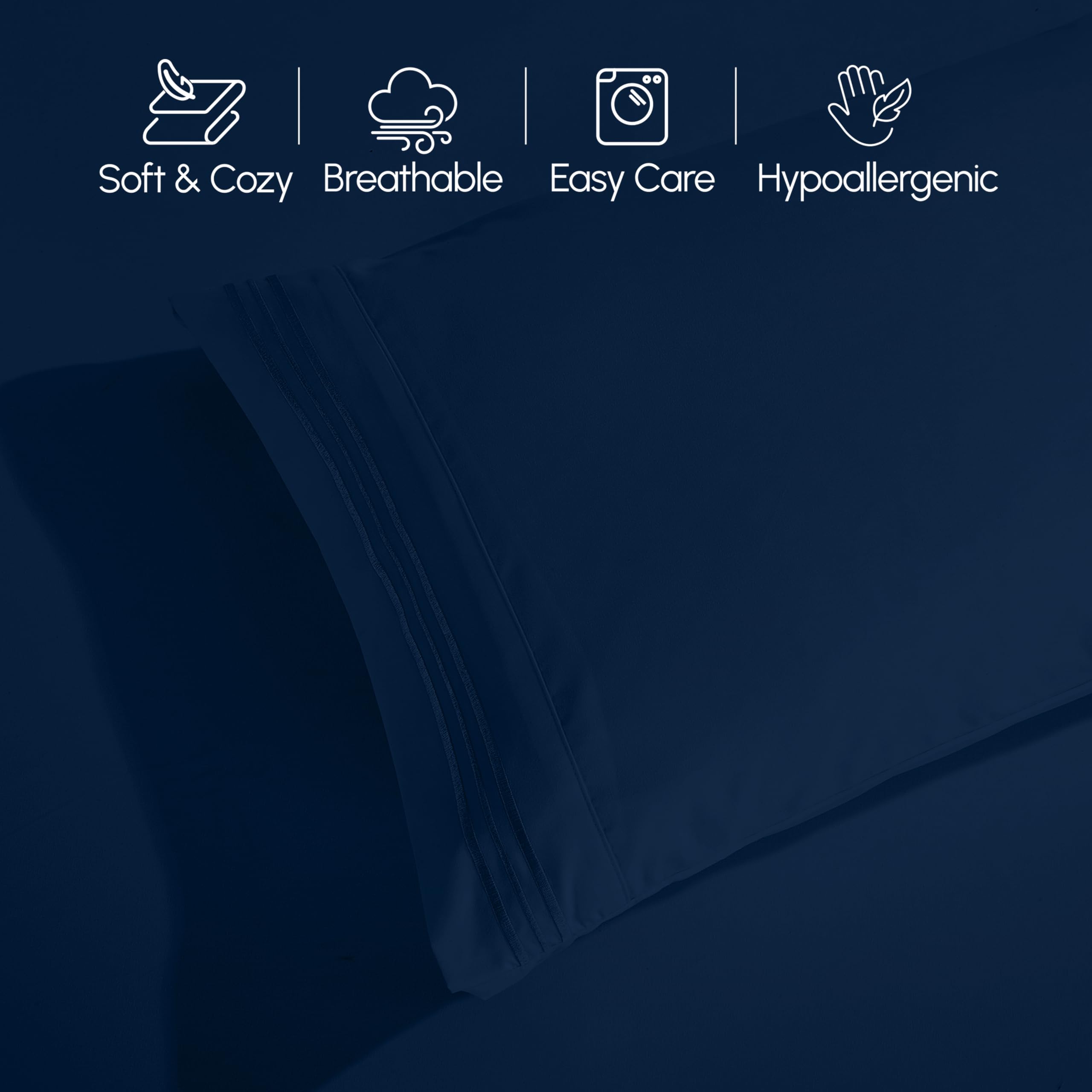 Elegant Comfort made bed in a modern bedroom showing navy sheets and styled look