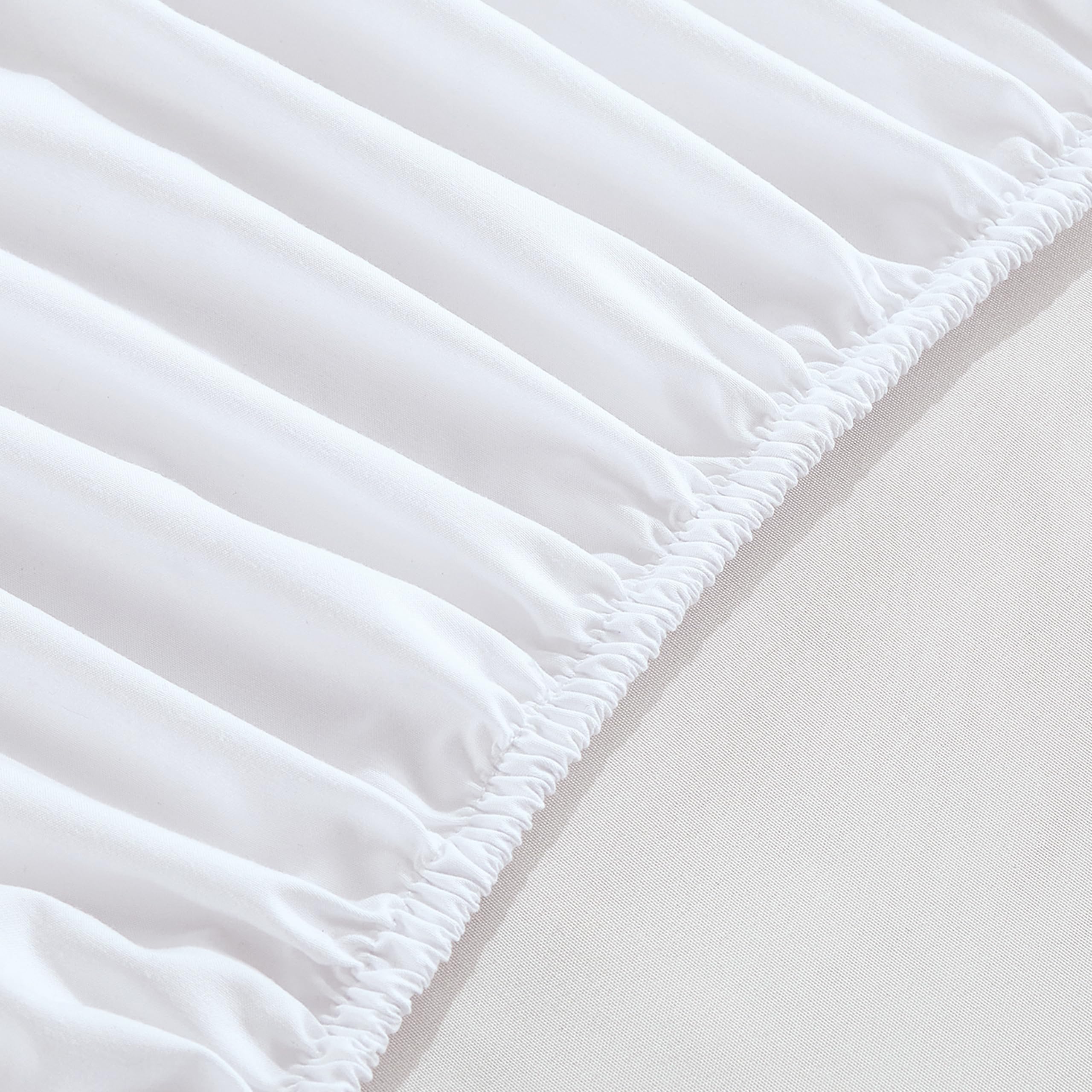 Elegant Comfort lifestyle shot of bed with sheet and pockets keeping bedside clutter tidy