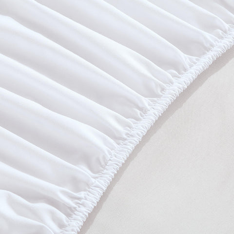 Elegant Comfort lifestyle shot of bed with sheet and pockets keeping bedside clutter tidy