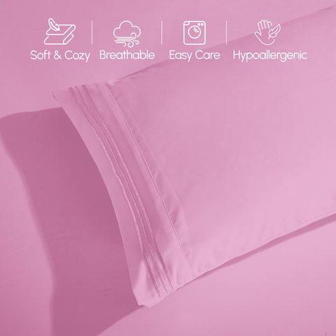 Elegant Comfort bedroom styling with light pink sheets creating a calming atmosphere