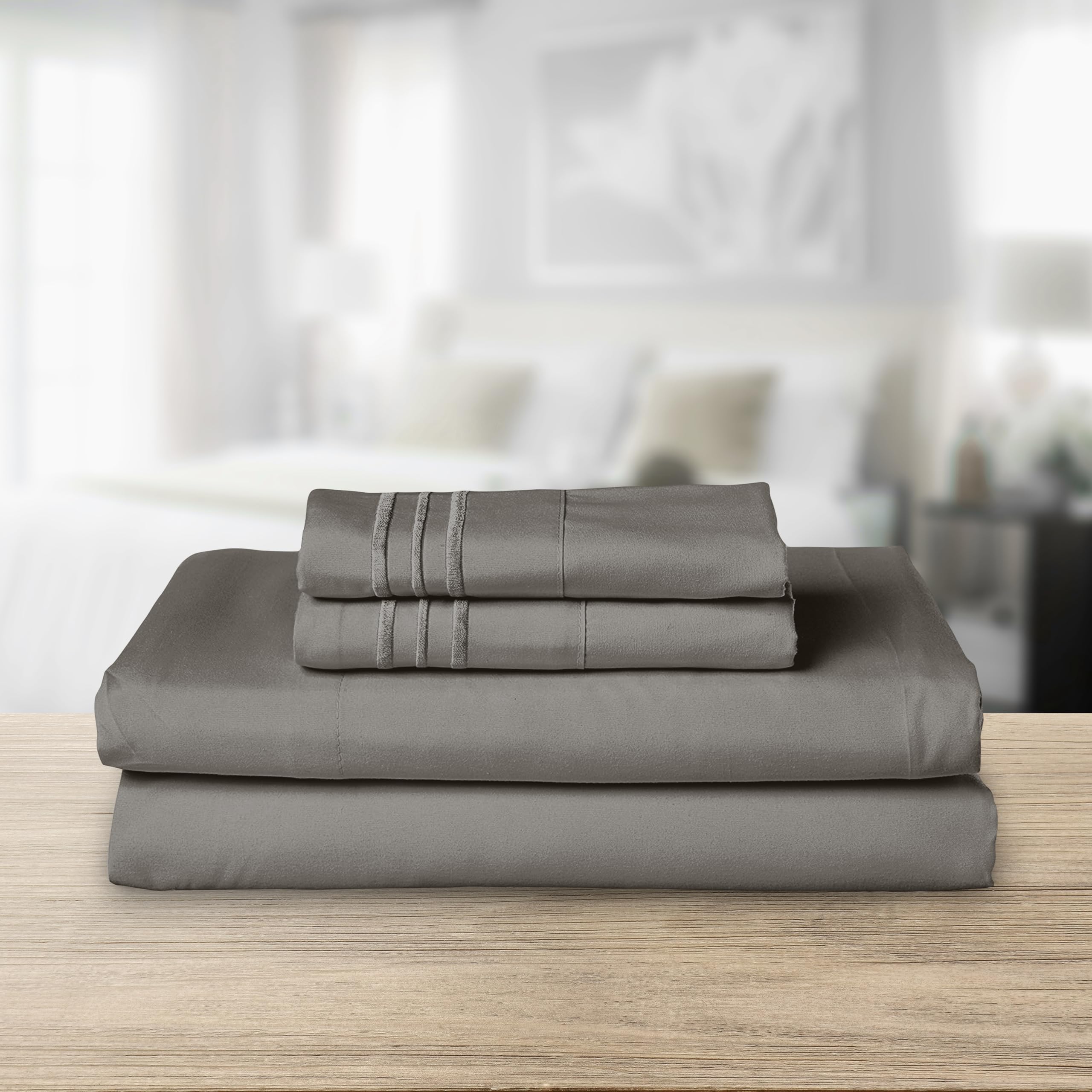 Elegant Comfort close-up of three-line embroidered pillowcase with refined detail