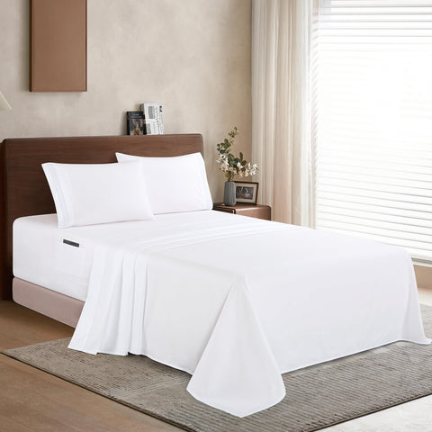 Elegant Comfort flat sheet spread across bed highlighting smooth, soft surface for comfort