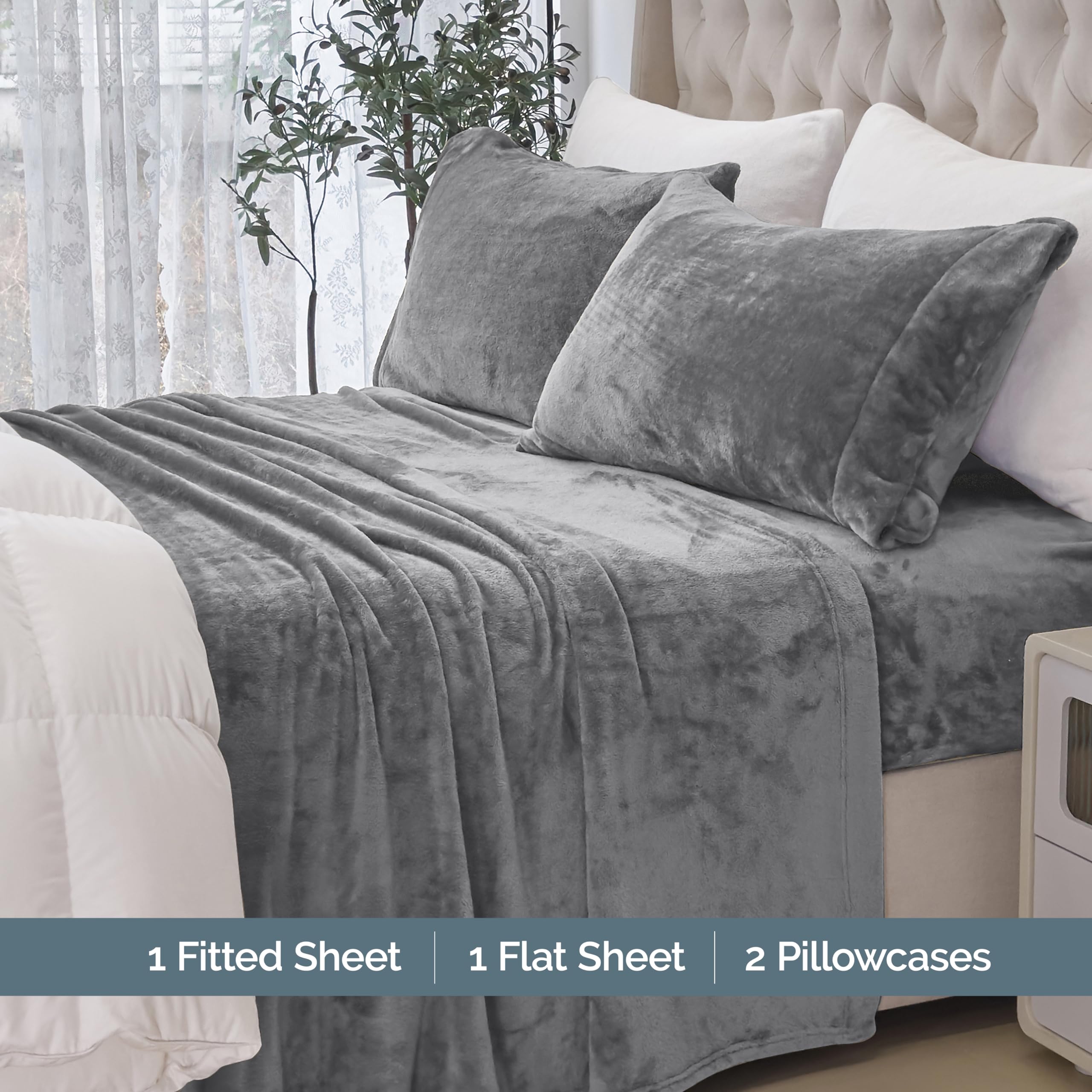 Elegant Comfort flat sheet spread across bed illustrating smooth coverage and cozy look